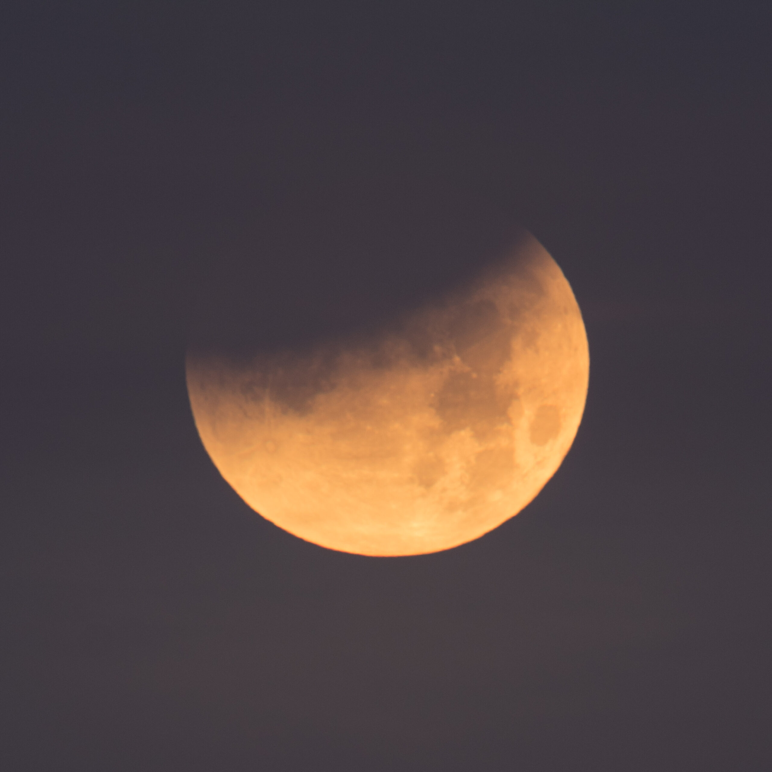 partially eclipsed Moon passing through the shadow of Earth