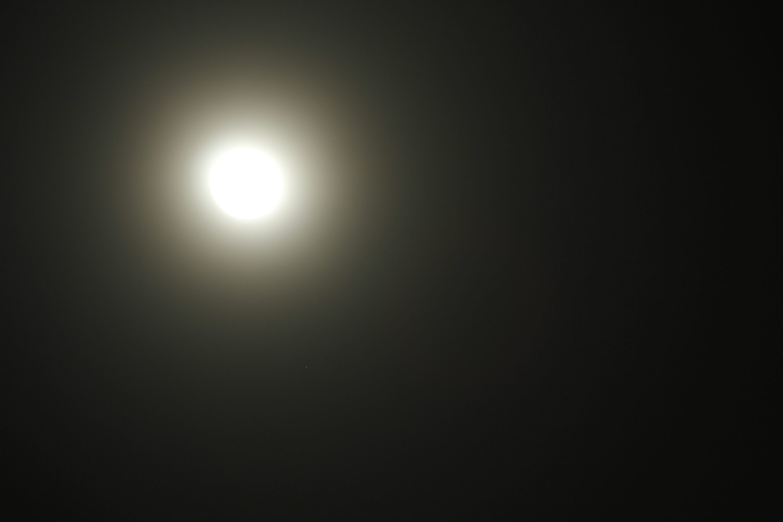 Overexposed photograph of the Moon showing loss of lunar surface detail