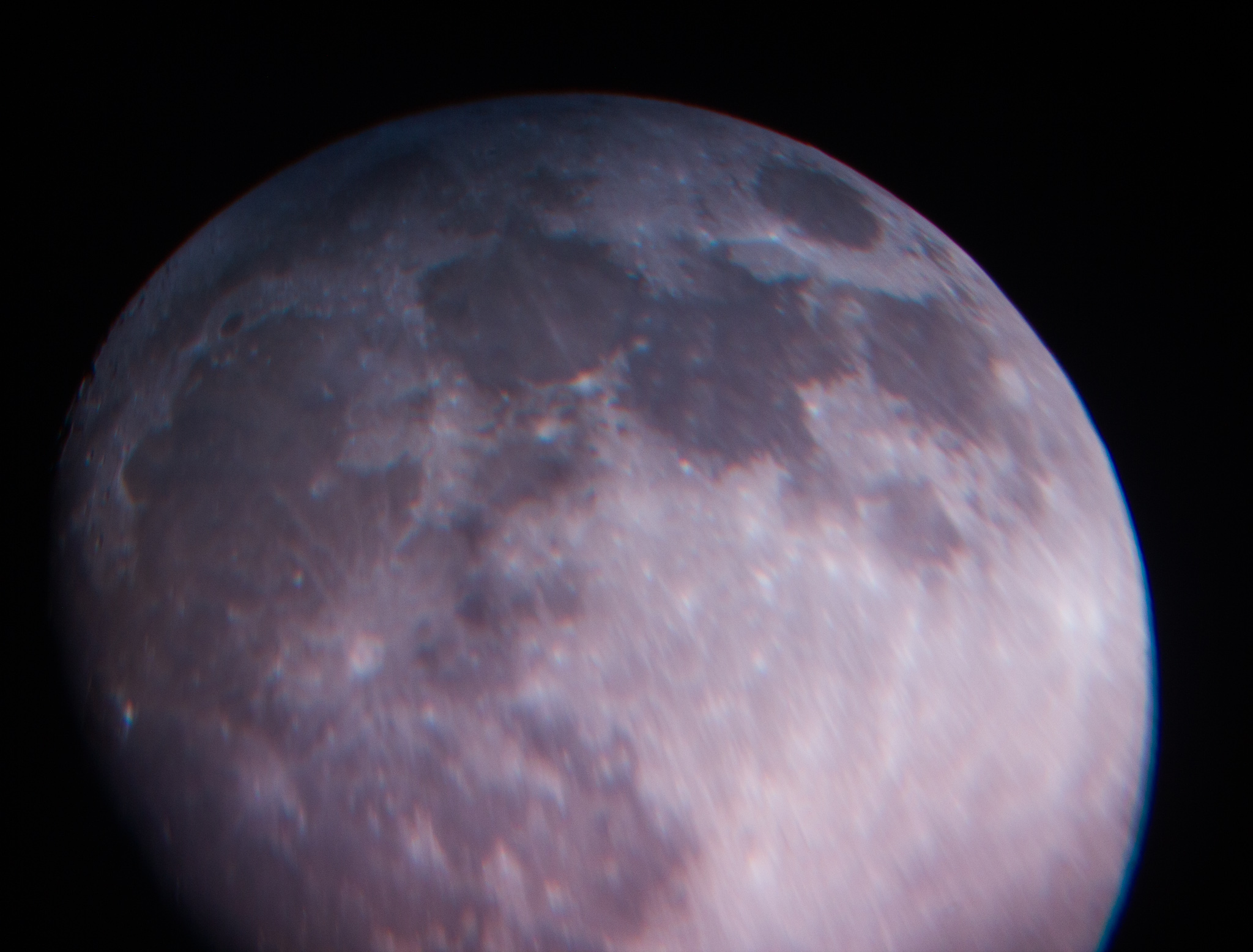 Close lunar photograph showing surface detail and dark maria.