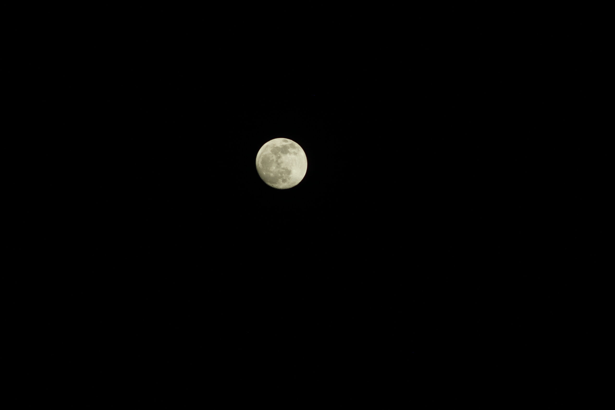 The Moon photographed against a wide black night sky.